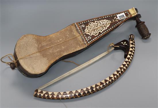 An Ottoman musical instrument and bow 54cm long